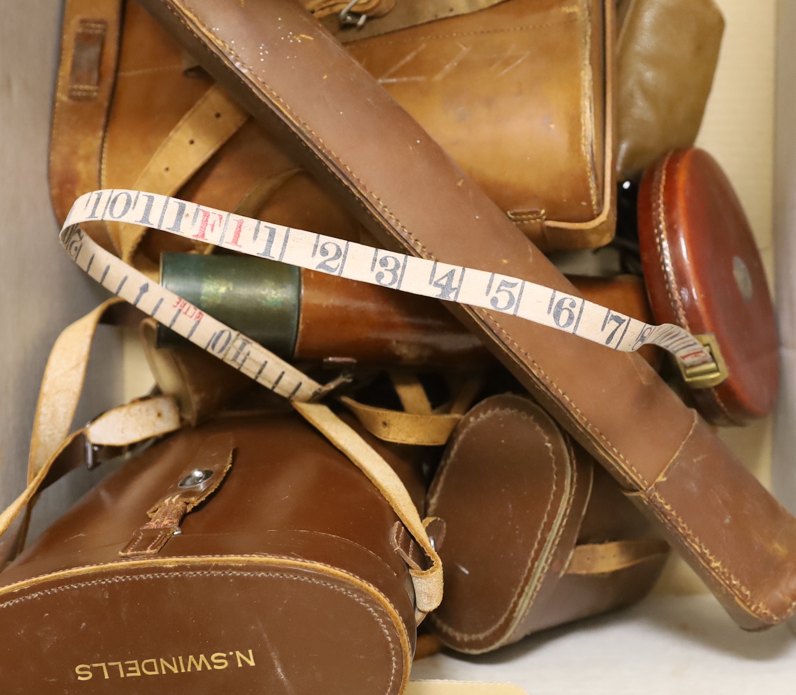 Mixed leather cased instruments, two pairs of binoculars, cameras etc